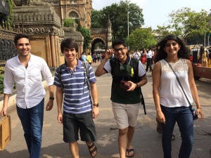 Pablo, me, Shreyas, and Kasturi striding in front of Victoria Terminus